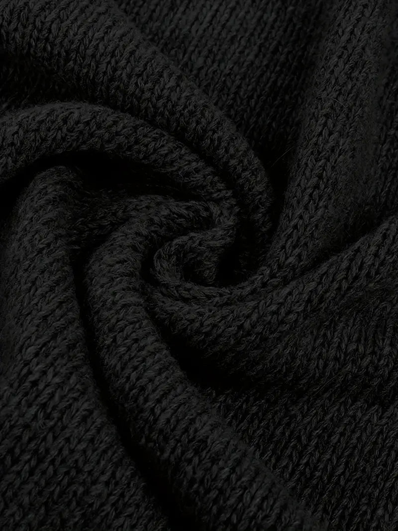 Black knit cardigan fabric close-up detail