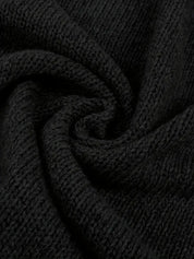 Black knit cardigan fabric close-up detail
