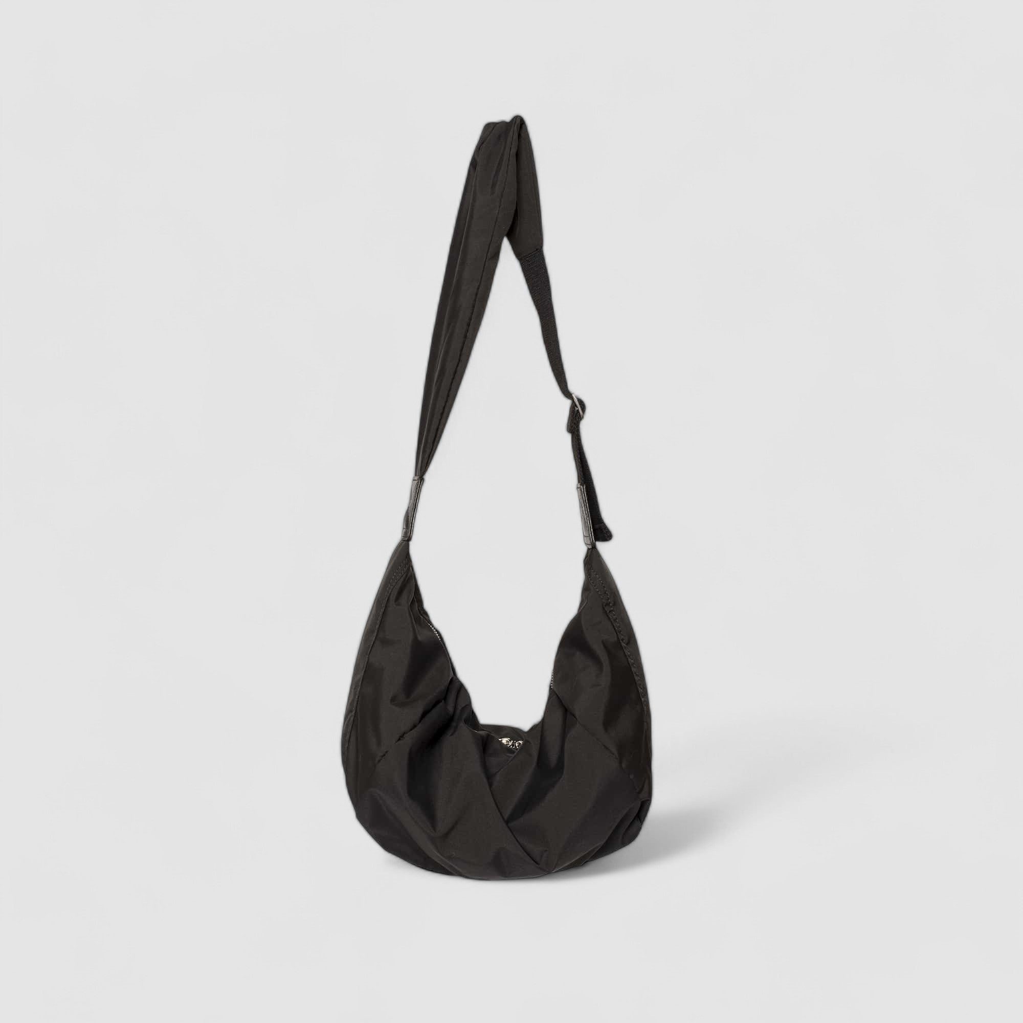 Black shoulder bag with adjustable strap, front view