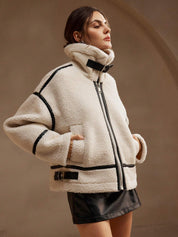 Cream fleece jacket with black trim upper body close-up