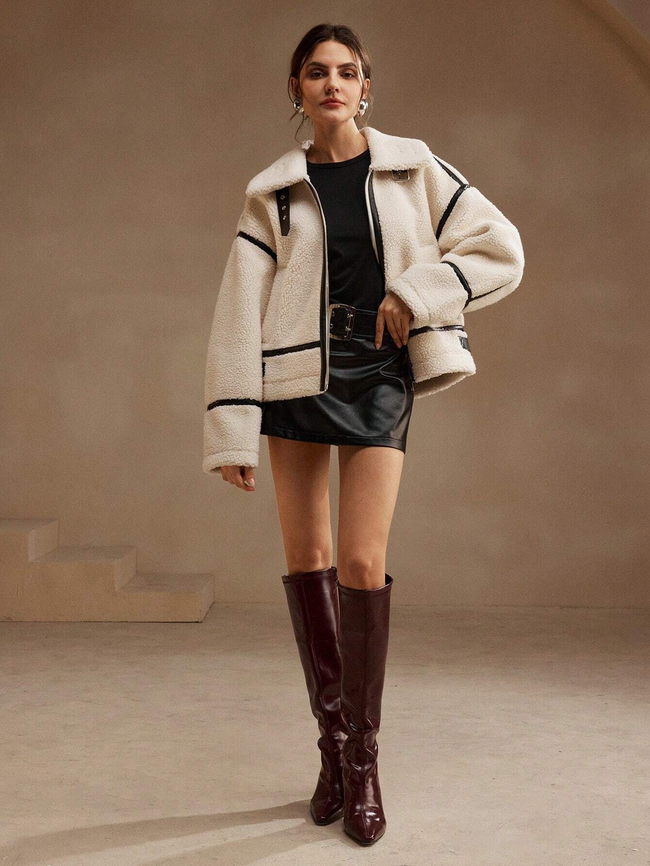 Cream fleece jacket with black trim full body front view
