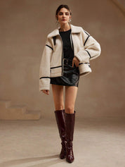 Cream fleece jacket with black trim full body front view
