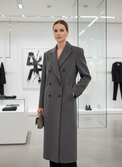 Gray wool blend overcoat front view with black trousers and clutch