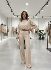 Beige blouse and pants set front view in store