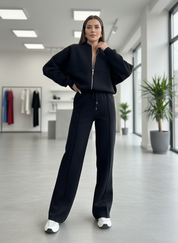 Black fleece tracksuit store front view