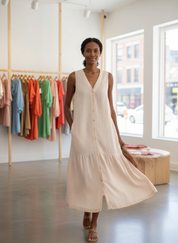 Beige tiered summer dress front view in store