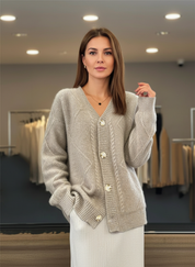 Beige knitted cardigan with gold buttons side view