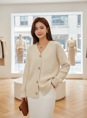 Cream knitted cardigan with gold buttons front view
