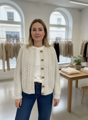 Cream cable knit cardigan with gold buttons front view
