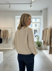 Cream cable knit cardigan side view