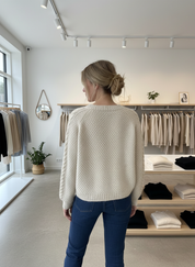 Cream cable knit cardigan back view