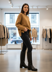 Brown leather boots with block heel worn with jeans and sweater