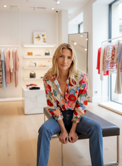 Blouse with vibrant floral design seated view