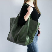 Green slouchy tote with large exterior pockets, front view
