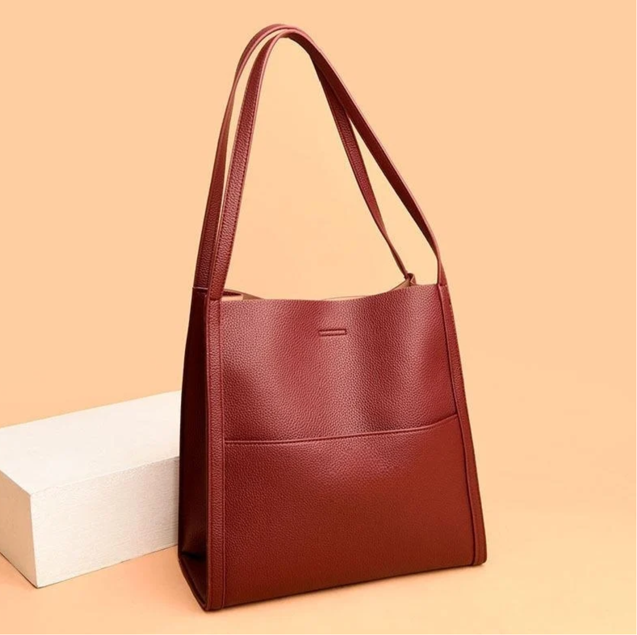 Red tote bag with textured leather front view