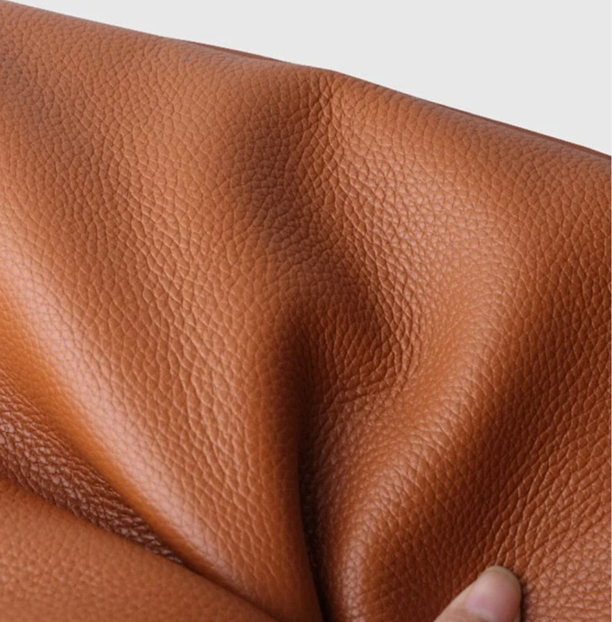 Close-up of brown tote bag textured leather detail