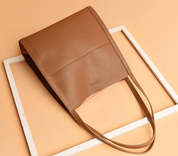 Brown tote bag with textured leather angled view