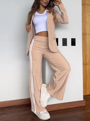 Beige track suit with white stripes front view