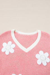 Trui roze met witte bloemen detail shot