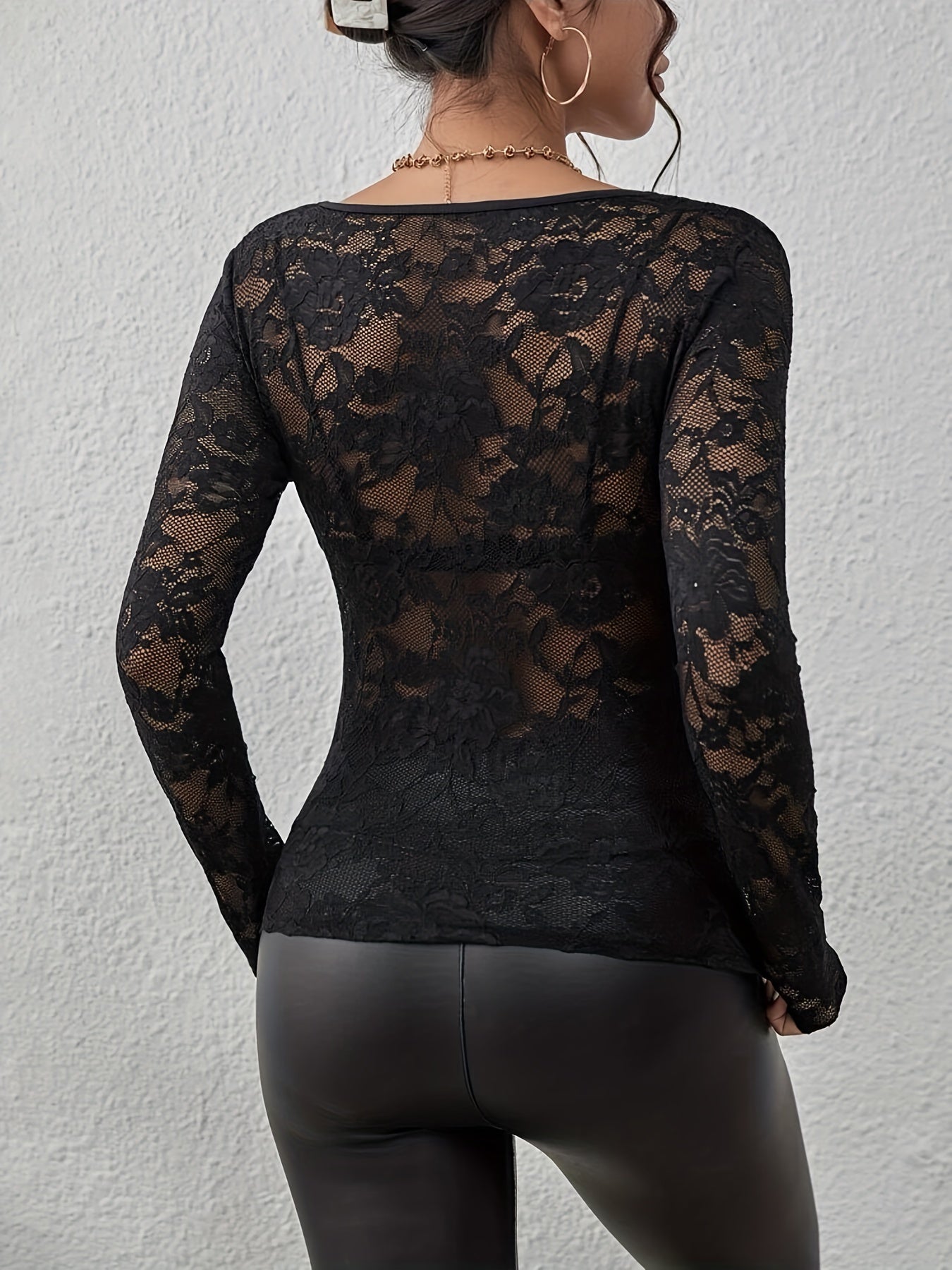 Black lace bodysuit with V-neck and long sleeves, back view