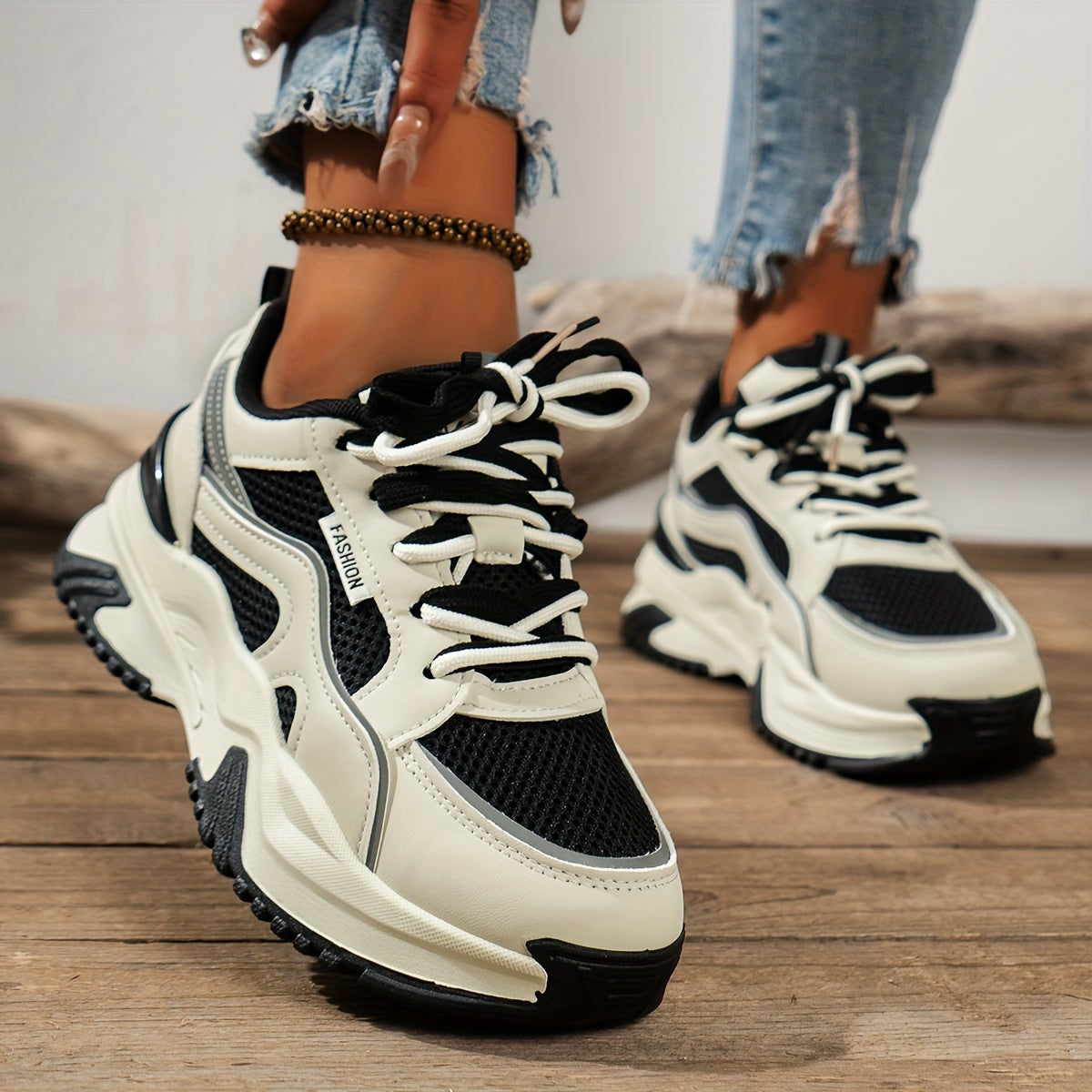 White and black chunky sneakers with mesh detail front view