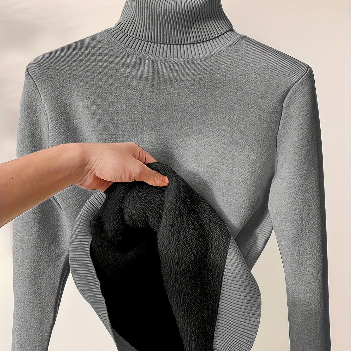 Gebreide trui donkergrijs turtle neck materiaal detail