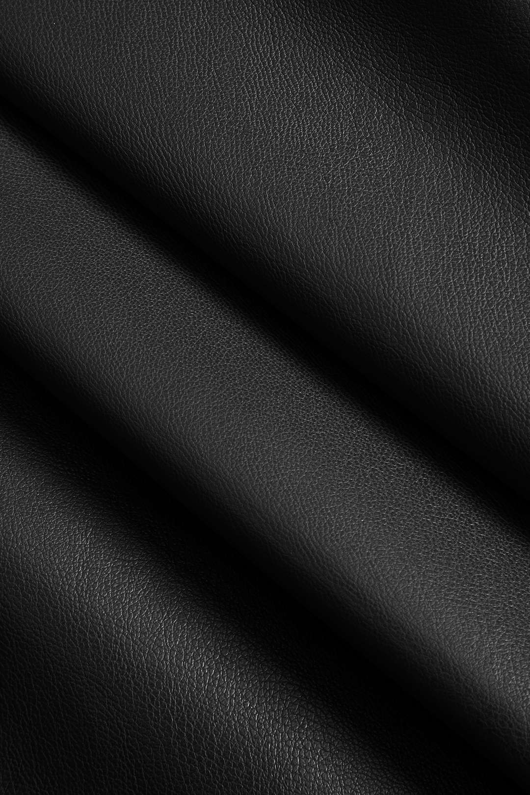 Faux leather trench coat black close-up texture