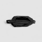 Black shoulder bag interior with zipper compartment, top view