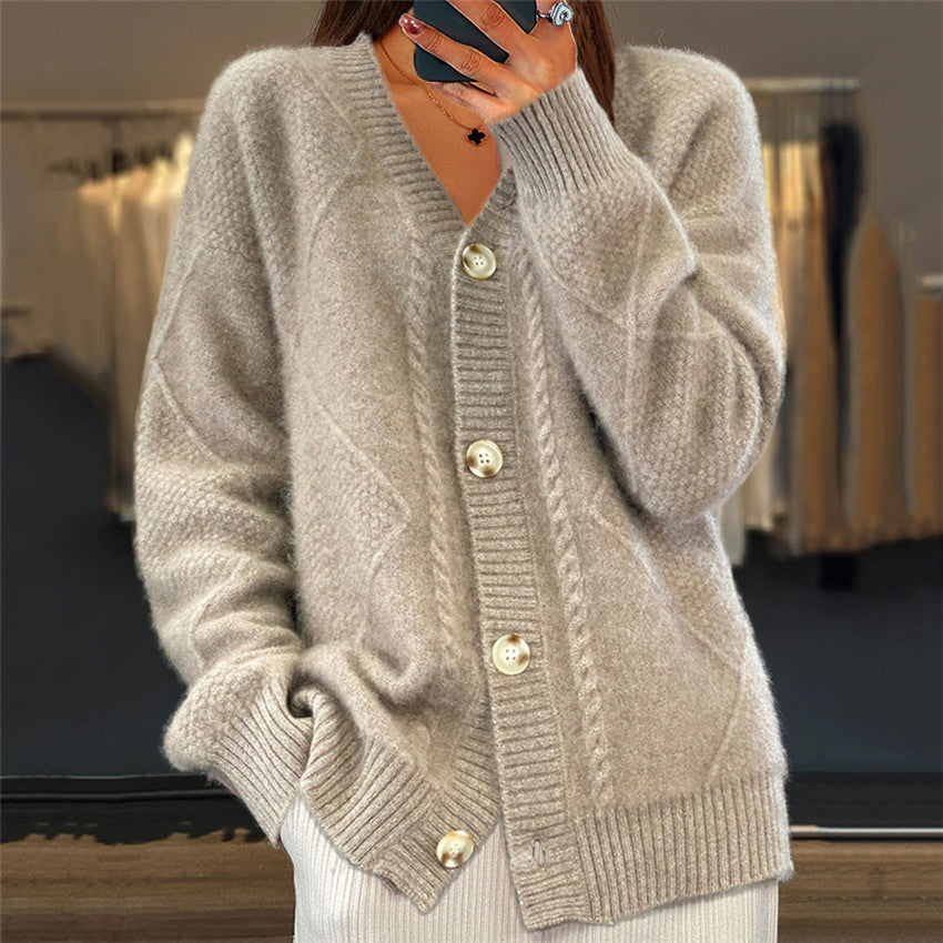 Beige knitted cardigan with gold buttons close-up