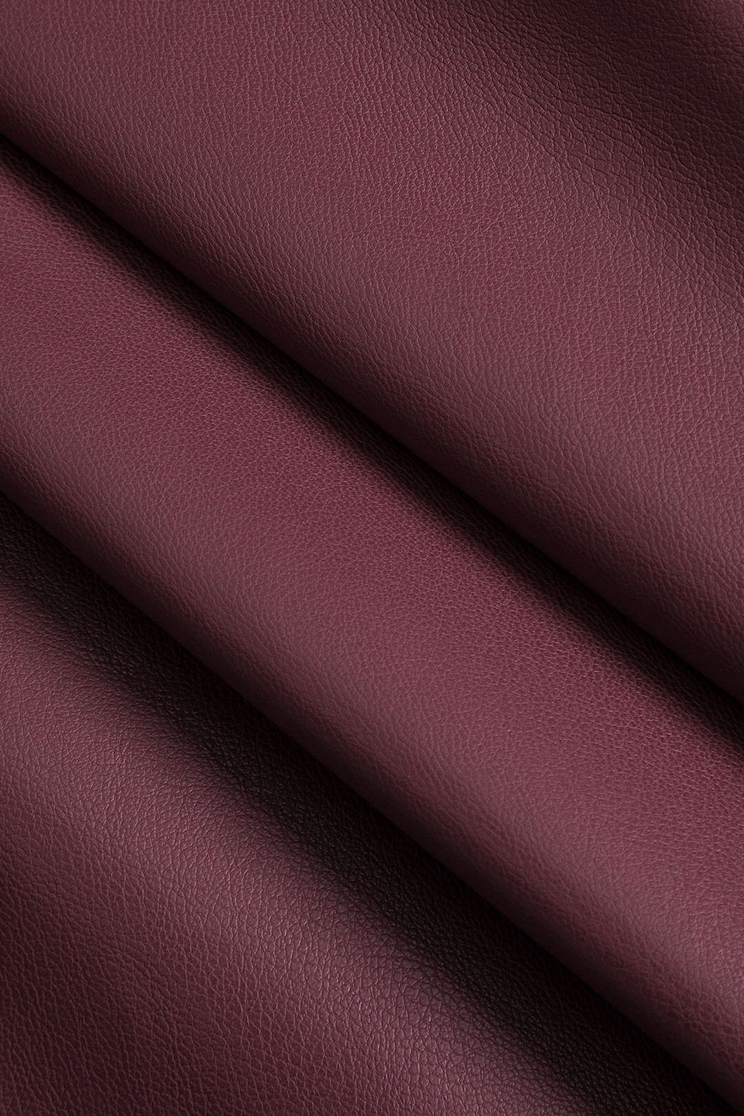 Faux leather trench coat burgundy close-up texture