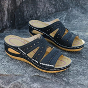 Black leather sandals with floral embroidery front view