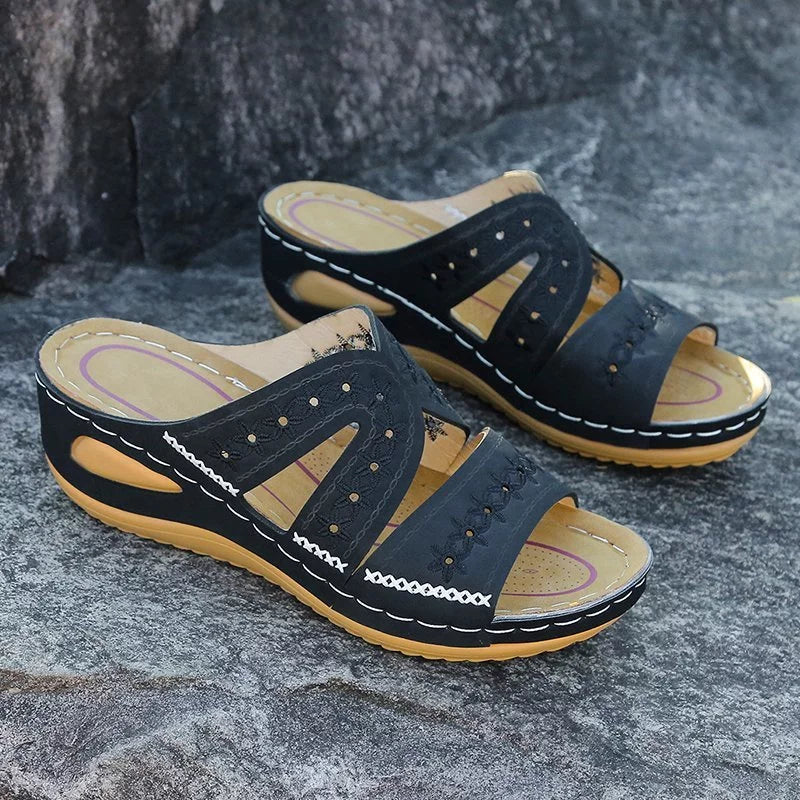 Black leather sandals with floral embroidery front view