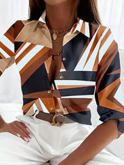 Blouse with geometric stripes in brown and navy, front view