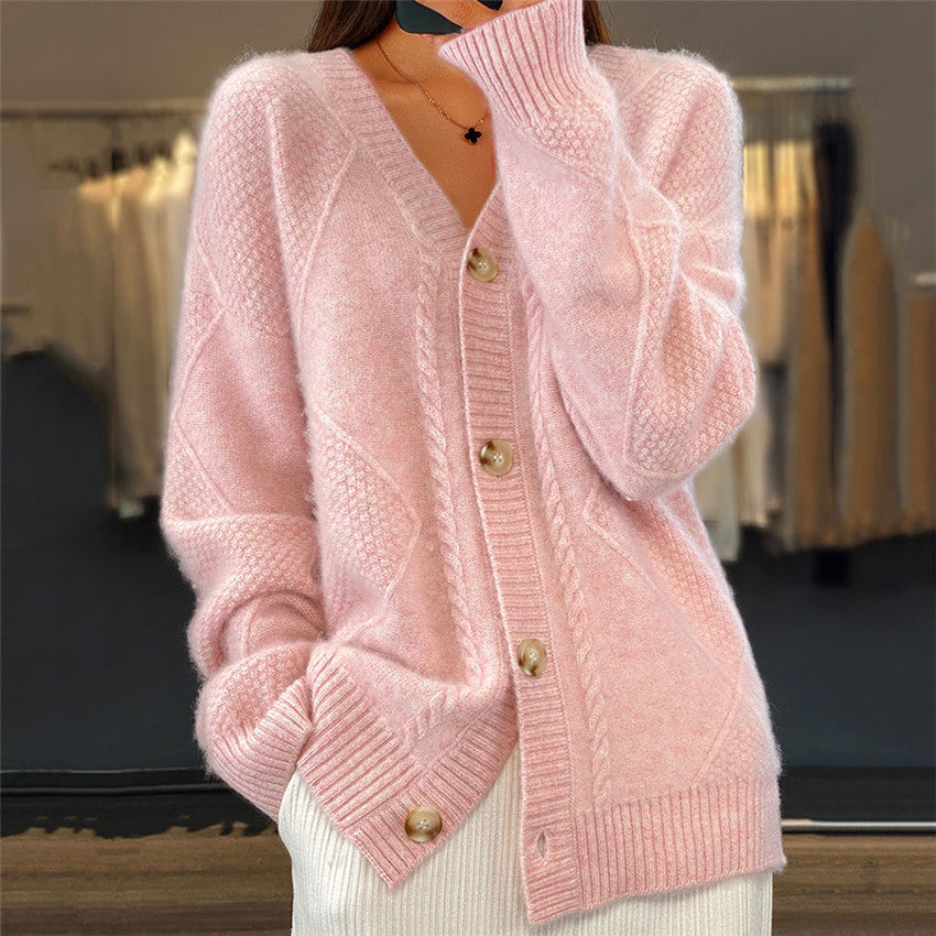 Pink knitted cardigan with gold buttons close-up