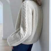 Cream cable knit cardigan back detail close-up