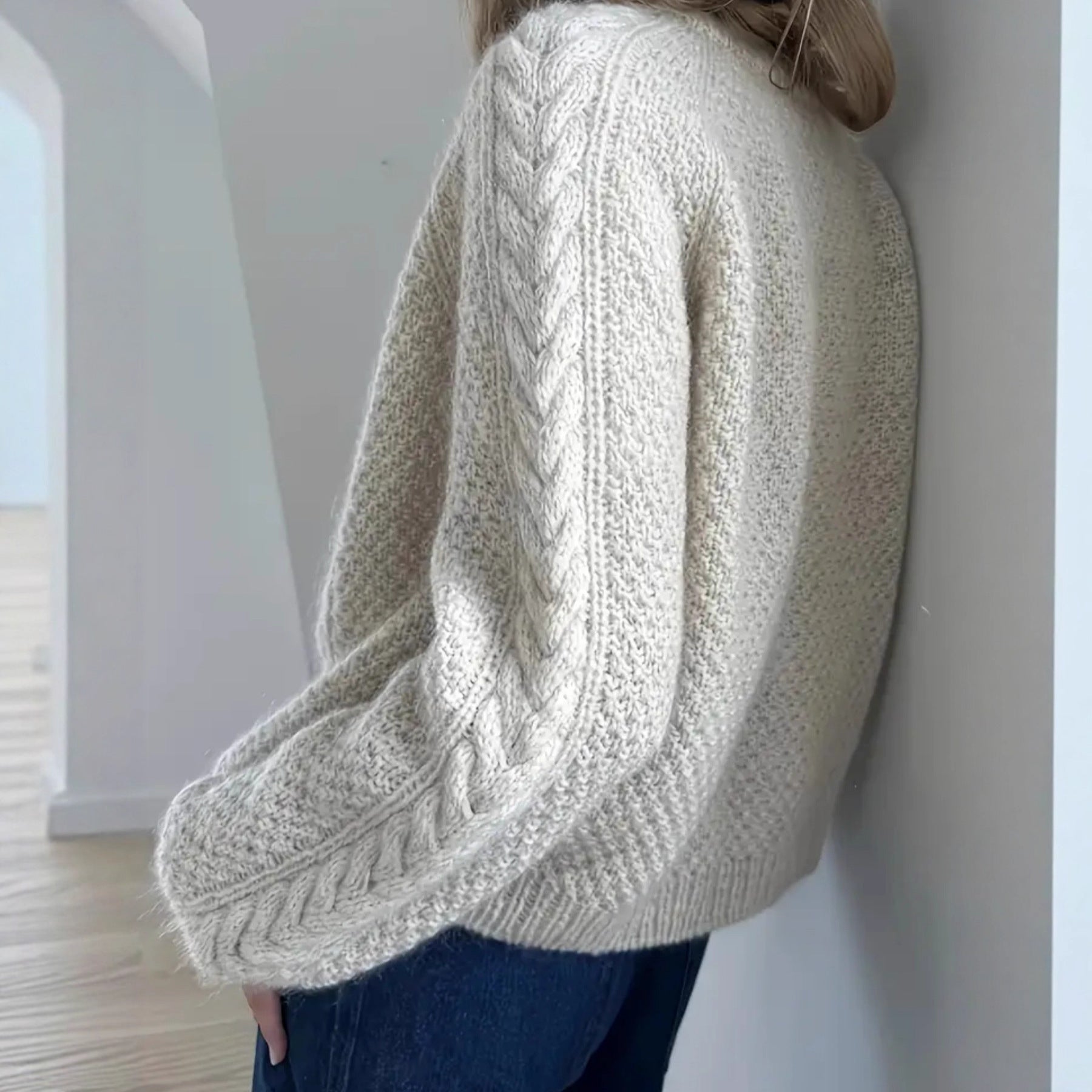 Cream cable knit cardigan back detail close-up