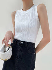 White ribbed tank top with denim pants front view