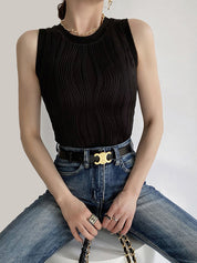Black ribbed tank top with denim pants and belt front view