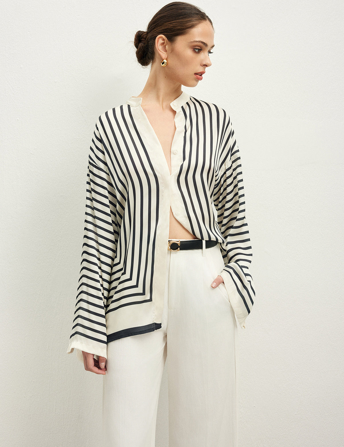 Striped blouse with band collar and white pants side view
