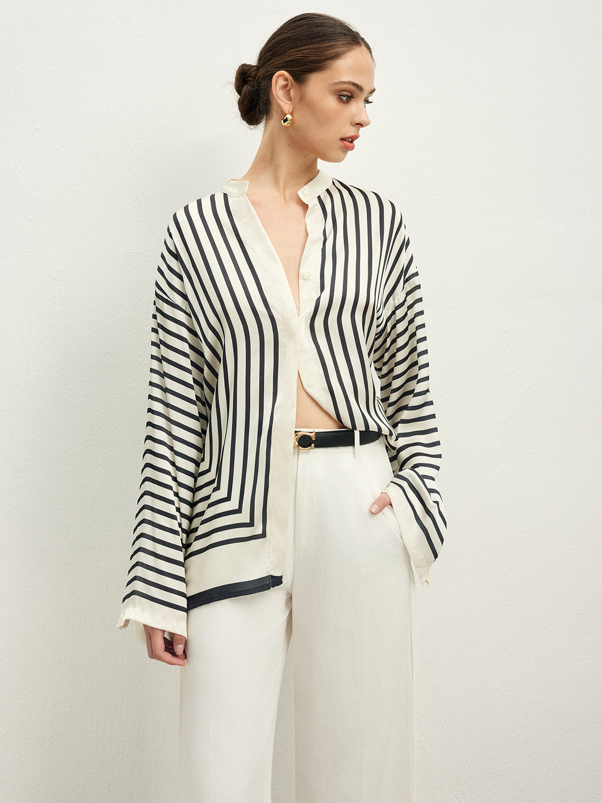Striped blouse with band collar and white pants side view