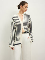 Striped blouse with band collar and white pants side view