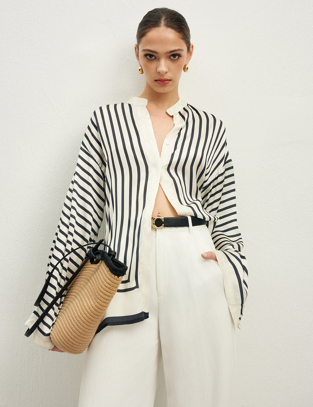 Striped blouse with band collar and white pants front view