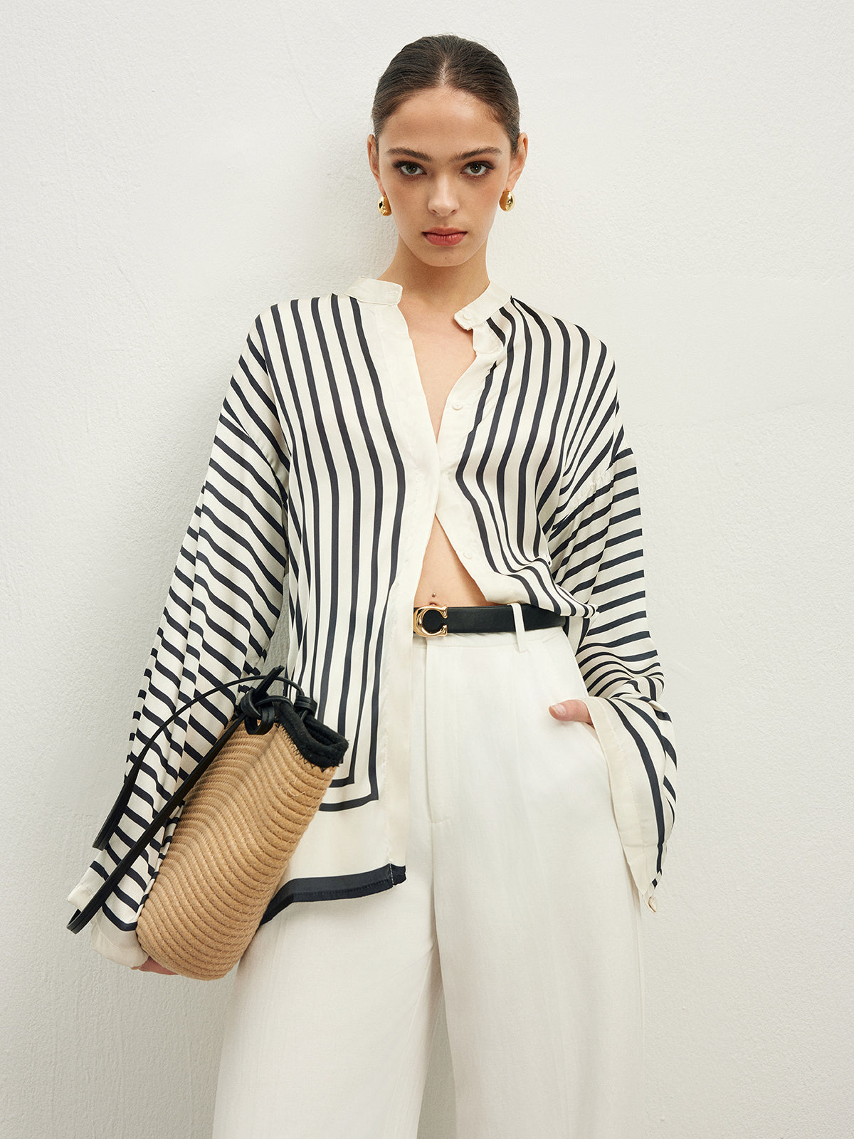 Striped blouse with band collar and white pants front view