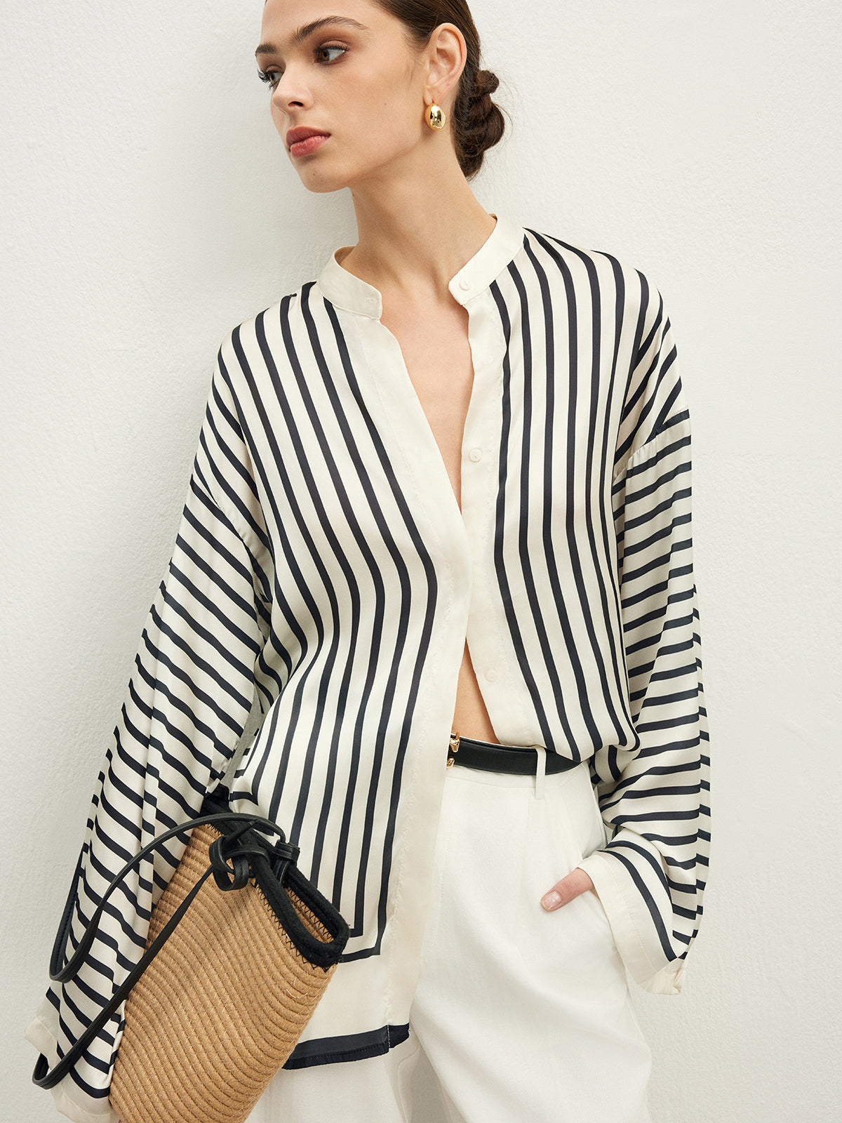 Striped blouse with band collar and white pants three-quarter view