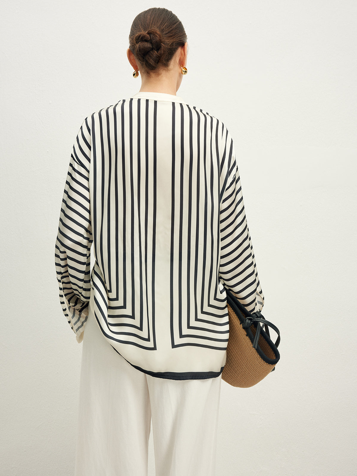 Striped blouse with band collar and white pants back view