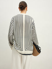 Striped blouse with band collar and white pants back view