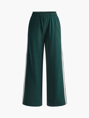 Dames broek groen met witte strepen zijprofiel