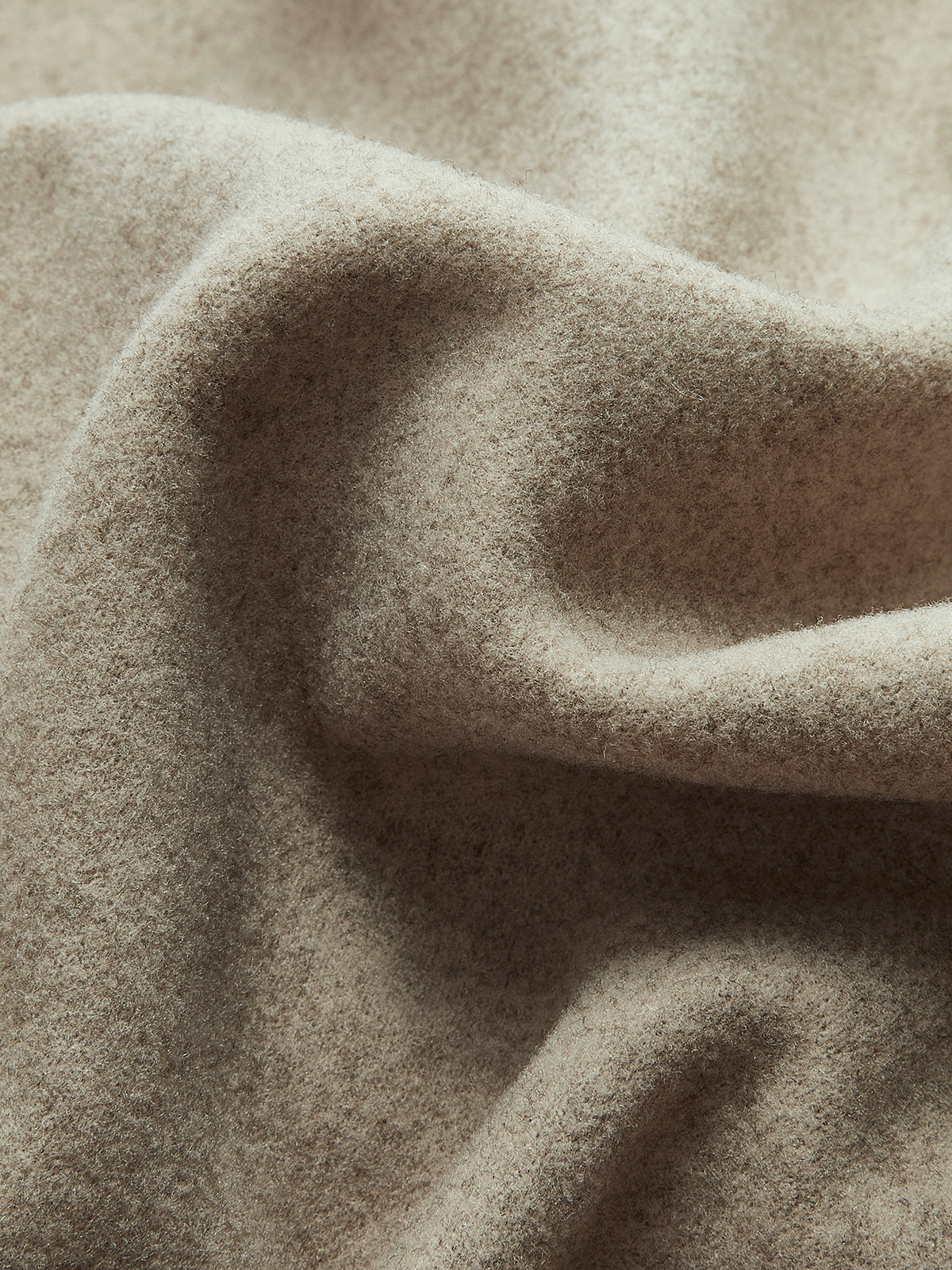 Oversized button-down jacket beige close-up detail