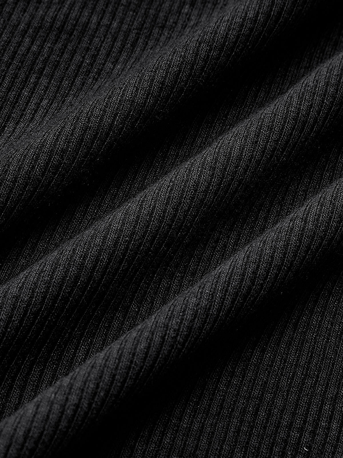 Zwart trui met ribstructuur detailopname