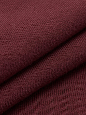 Trui donkerrood gebreid detailopname